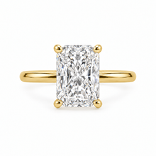 Load image into Gallery viewer, An radiant-cut diamond engagement ring with a yellow gold band, set against a plain white background.
