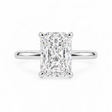 Load image into Gallery viewer, An radiant-cut diamond engagement ring with a polished silver-colored band, shown against a plain white background.