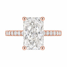 Load image into Gallery viewer, A rose gold engagement ring featuring a large rectangular radiant-cut diamond center stone and a pavé-set diamond band, shown on a plain white background.