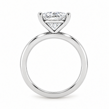 Load image into Gallery viewer, A silver-toned diamond ring featuring a radiant-cut diamond solitaire in a four-prong setting, shown against a plain white background.