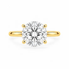 Load image into Gallery viewer, A classic solitaire engagement ring featuring a round brilliant-cut diamond set in a yellow gold four-prong band, shown against a plain white background.