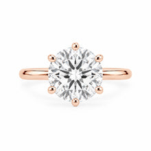 Load image into Gallery viewer, A silver solitaire engagement ring featuring a round brilliant-cut clear gemstone in a six-prong setting, shown against a plain white background.