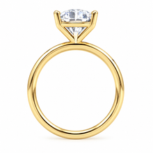 Load image into Gallery viewer, A yellow gold ring with a brilliant round-cut diamond set in a four-prong setting, shown against a plain white background.