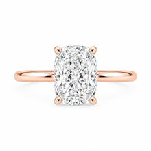 Load image into Gallery viewer, An engagement ring featuring a large cushion-cut diamond set in a polished rose gold four-prong setting, shown against a solid white background.
