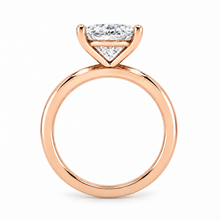 Load image into Gallery viewer, A rose gold engagement ring featuring a emerald cut diamond, shown on a clean white background.

