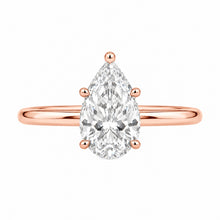 Load image into Gallery viewer, A pear-cut diamond ring set in a rose gold band with a four-prong setting, shown against a plain white background.
