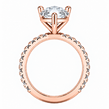 Load image into Gallery viewer, Rose gold ring with a marquise-cut clear center stone and a band accented with small round stones, shown on a plain white background.
