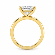 Load image into Gallery viewer, A yellow gold ring with a radiant-cut diamond shown on a plain white background.
