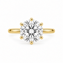 Load image into Gallery viewer, A classic yellow gold solitaire engagement ring featuring a round brilliant-cut diamond set in a six-prong setting, shown against a clean white background.
