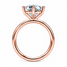 Load image into Gallery viewer, A rose gold solitaire ring featuring a round brilliant-cut clear gemstone in a six-prong setting, shown against a plain white background.
